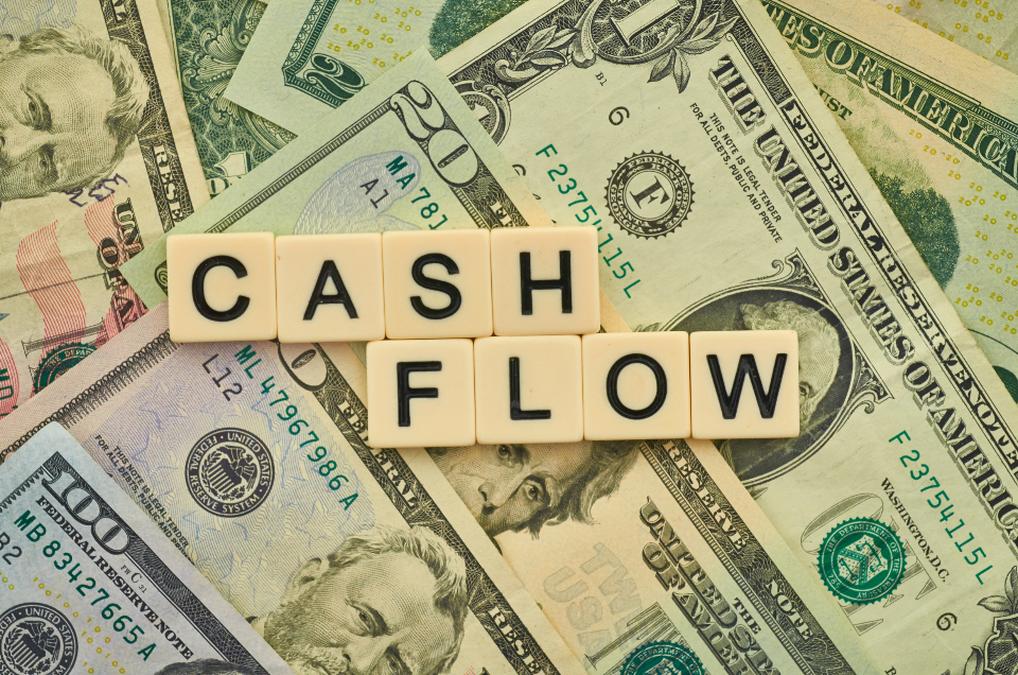 a pile of cash and cash cash in a pile of cash - Cash Flow